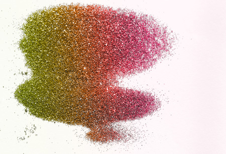 Green and red glitter on light background - macro photoの写真素材