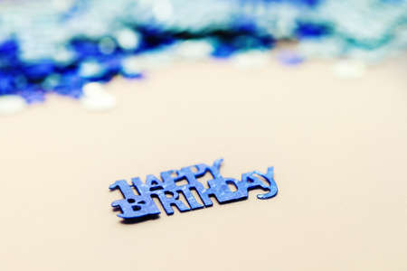 Blue happy birthday confetti pieces - macro photoの写真素材