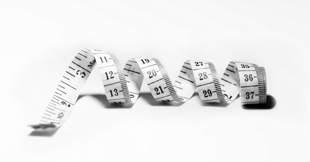 Photo of a white tape measure isolatedの写真素材