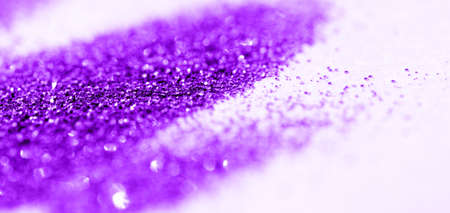 Magenta glitter on light background - macro photo