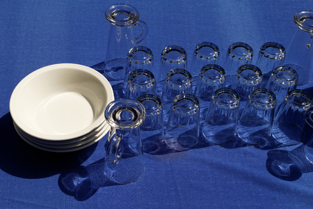 Photo of the clean dishes in the tableの写真素材