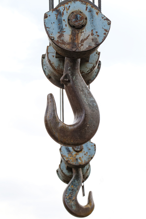 Photo of the big and old iron crane hookの写真素材