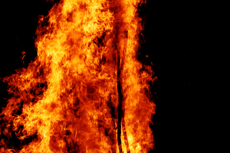 Photo of the campfire flames in the dark