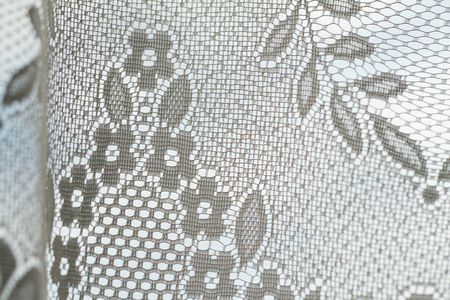 Photo of a lace curtains in the window