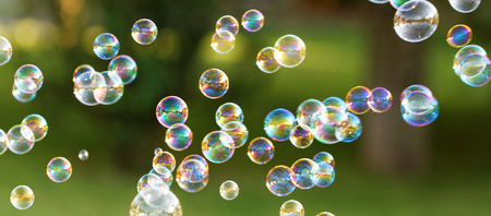 The rainbow bubbles from the bubble blowerの写真素材