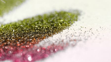 Multicolor glitter on light background - macro photoの写真素材