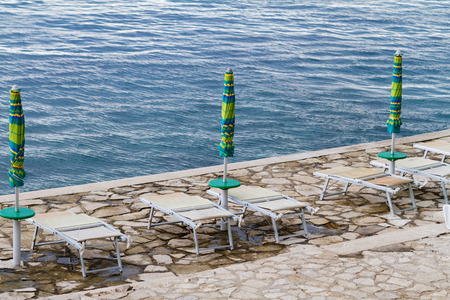 Striped beach umbrella on the beach - Croatiaの写真素材