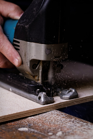 man working with fret sawの写真素材