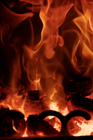 Fire flames with reflection on black backgroundの写真素材