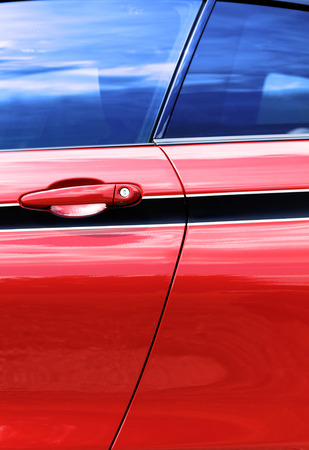 Detail on hot red sport car - car door handleの写真素材