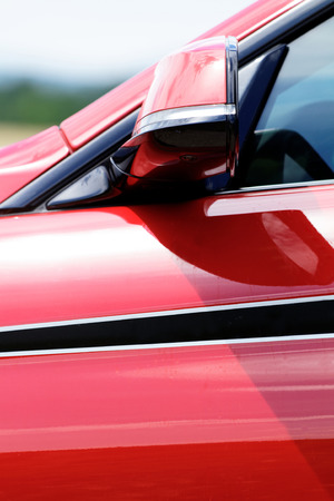 Detail on hot red sport car - side rearview mirrorの写真素材