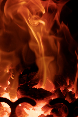 Fire flames with reflection on black backgroundの写真素材