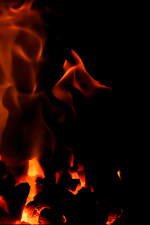 Fire flames with reflection on black backgroundの写真素材