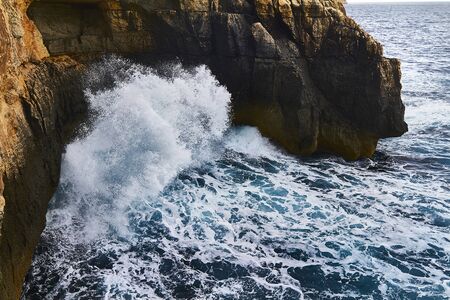 Huge waves crash on cloudy day. Greece -Kemmuna island