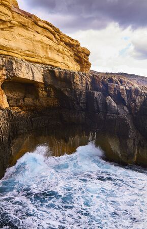 Huge waves crash on cloudy day. Greece -Kemmuna islandの写真素材