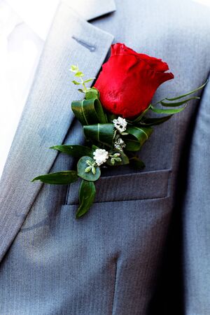 Wedding boutonniere on suit of groom - wedding flowerの写真素材