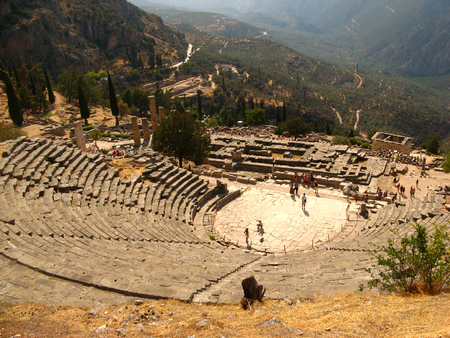 View from the mountain to the ruins of an ancient amphitheater in Greek Delphi