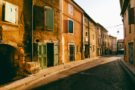 Houses along quiet main road in Bonnieux, Provence.のeditorial素材