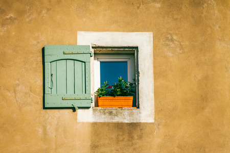 shabby chic window on stucco wallの写真素材