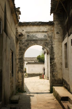 arched doorway in hongcun village, chinaの写真素材