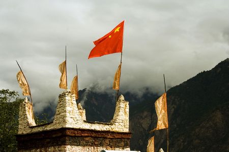 red flag on rooftop in tibet