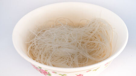 raw vermicelli thai style on dish with isolated on whiteの写真素材