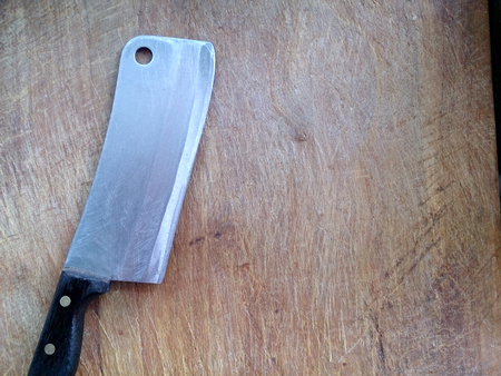 vintage cutting board with knife on planks food background concept