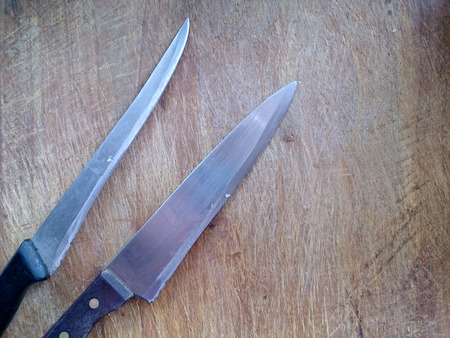 vintage cutting board with knife on planks food background conceptの写真素材