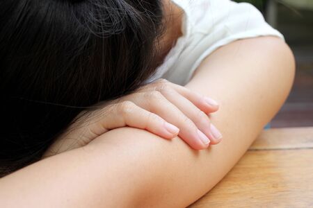 beautiful woman on her arm fell sleepyの写真素材