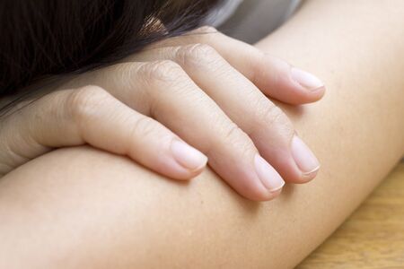 beautiful woman on her arm fell sleepyの写真素材