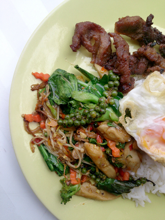 Fried herbal vegetables & Fried Pock & Fired Egg with Riceの写真素材