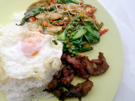 Fried herbal vegetables & Fried Pock & Fired Egg with Riceの写真素材