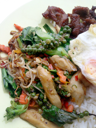 Fried herbal vegetables & Fried Pock & Fired Egg with Riceの写真素材