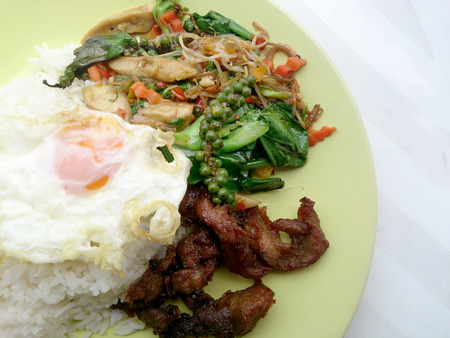 Fried herbal vegetables & Fried Pock & Fired Egg with Riceの写真素材