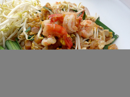 Delicious rice noodles with shrimp close-up on a plate.の写真素材