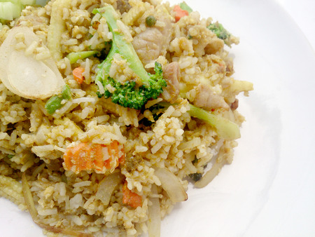 Close up green curry fried rice on dish, Delicious fried rice with chicken green curry, Thai Foodの写真素材