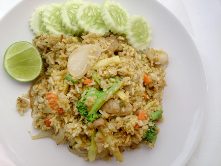 Close up green curry fried rice on dish, Delicious fried rice with chicken green curry, Thai Foodの写真素材