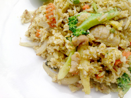 Close up green curry fried rice on dish, Delicious fried rice with chicken green curry, Thai Foodの写真素材