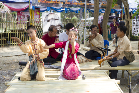 April 10, 2016 : The Boy and The Girl sing a song in lanna style, in the north of thailand at public park (Khelang Nakorn Park) in songkran festival in Lampang, Thailand on April 10 , 2016のeditorial素材