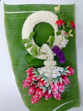 Jasmine garland Thai on banana leaf have unique ways of arranging flowers and using them in decorations, which are different from other places. Thai garlands called "Phuang Malai"の写真素材