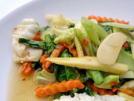 Vegetarian stir fry with thai jasmine rice on white dish, healthy foodの写真素材
