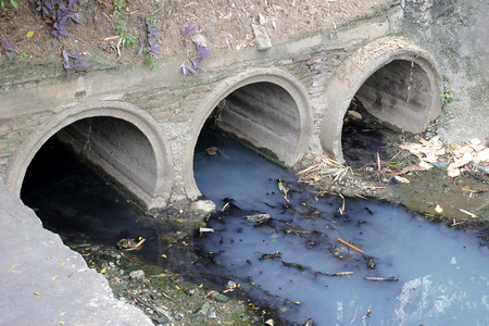 Toxic water running from sewers in dirty underground sewer for dredging drain tunnel cleaningの写真素材
