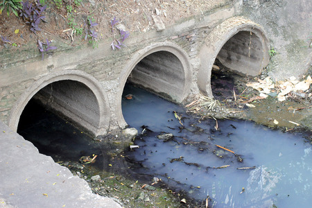 Toxic water running from sewers in dirty underground sewer for dredging drain tunnel cleaningの写真素材