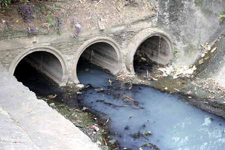 Toxic water running from sewers in dirty underground sewer for dredging drain tunnel cleaningの写真素材