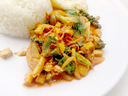 Fried vegetables and Tofu with Chilli Curry, Hot and Spicy Vegetarian Food in white dish on white background, Healthy Food. Thai Foodの写真素材