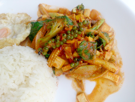 Fried vegetables and Tofu with Chilli Curry, Hot and Spicy Vegetarian Food in white dish on white background, Healthy Food. Thai Foodの写真素材