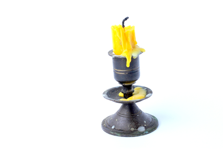 old candle vintage bronze candlestick  isolated on a white background.の写真素材