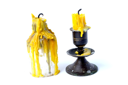 old candle vintage bronze candlestick  isolated on a white background.の写真素材