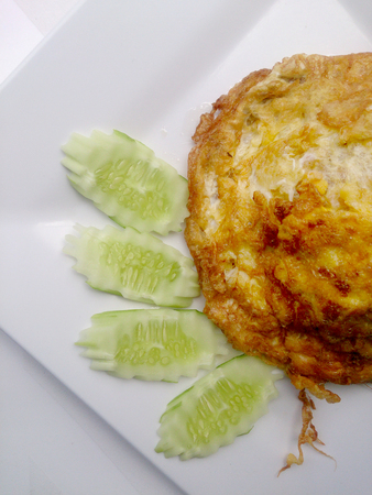 omelette on the white dish, It's popular traditional Thai style food.の写真素材