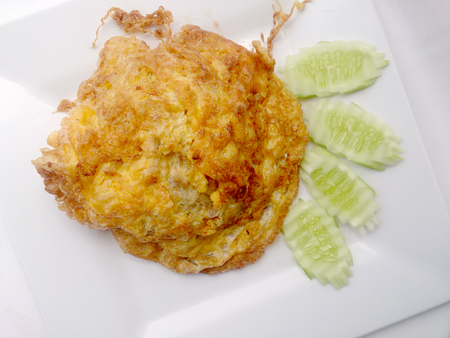 omelette on the white dish, It's popular traditional Thai style food.の写真素材